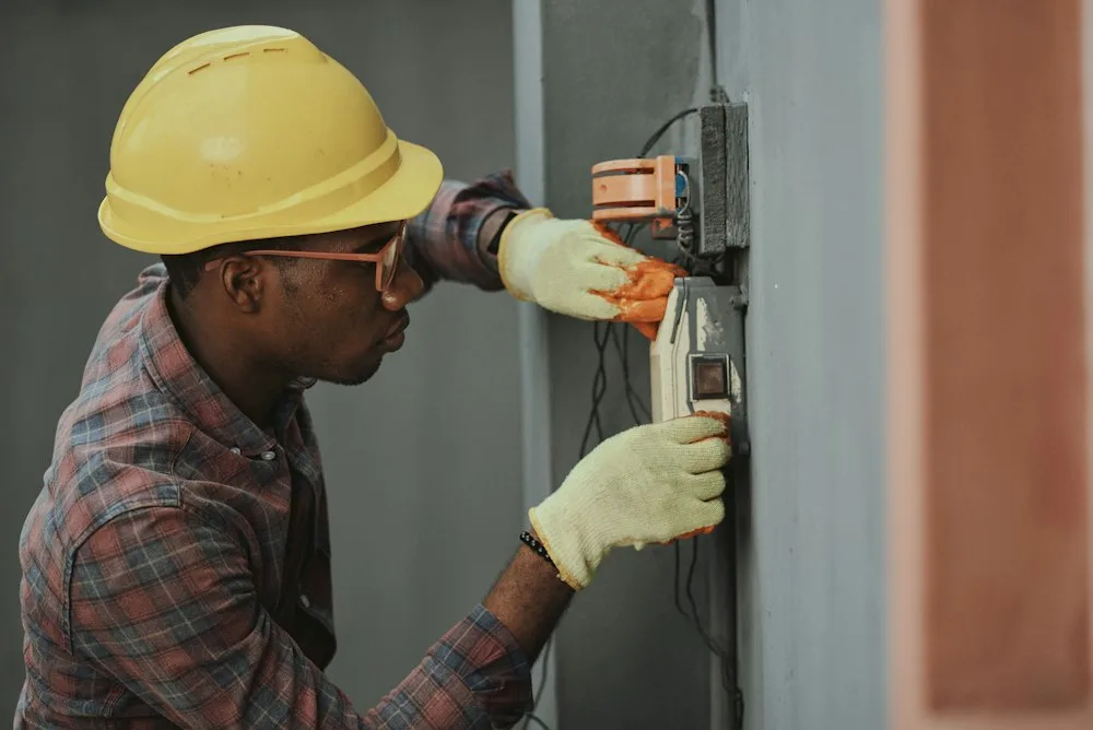Repair technician diagnosing home appliance